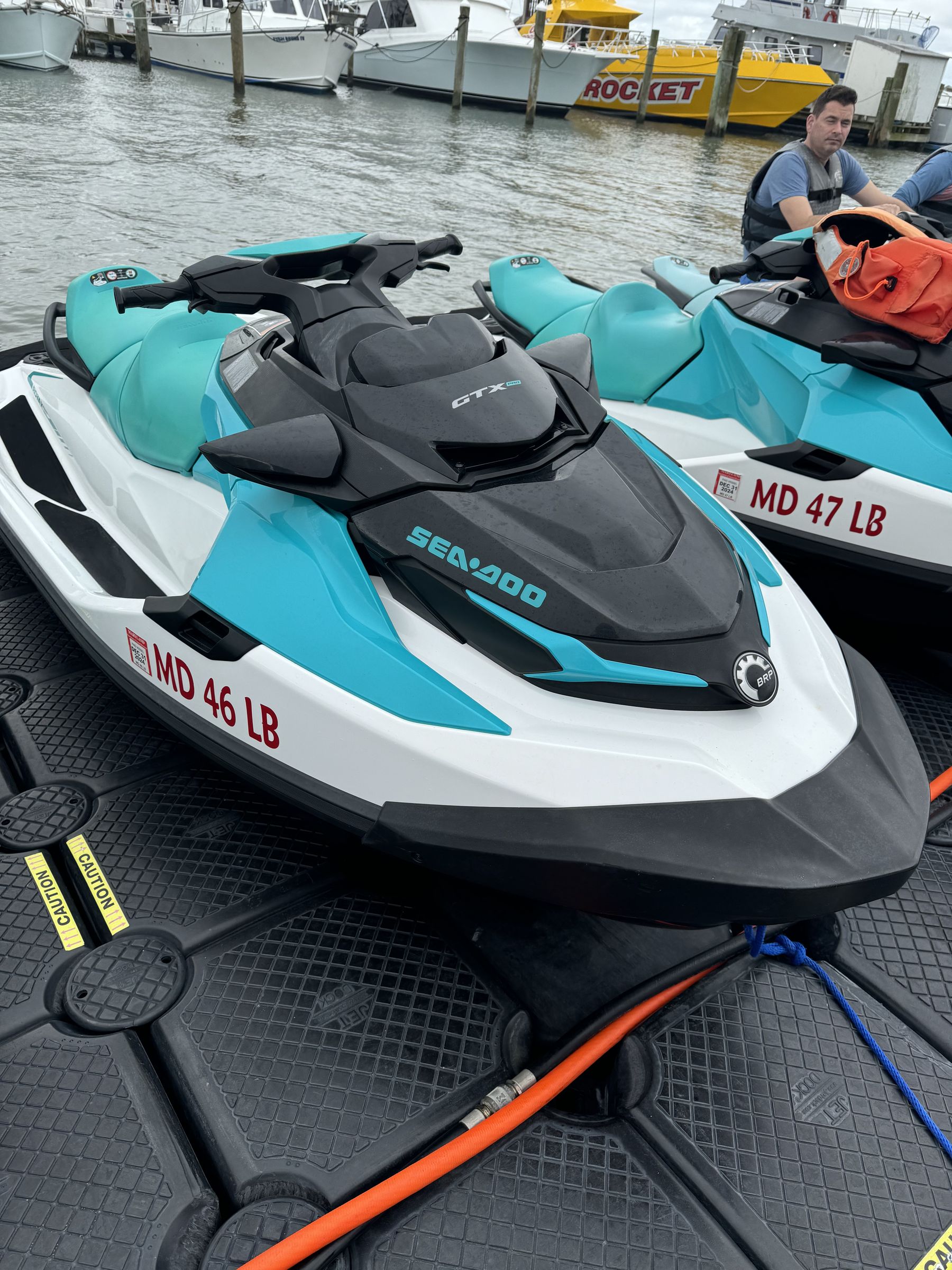 Two Sea-Doo GTX Pro 130 fleet skis lined up on the floating dock