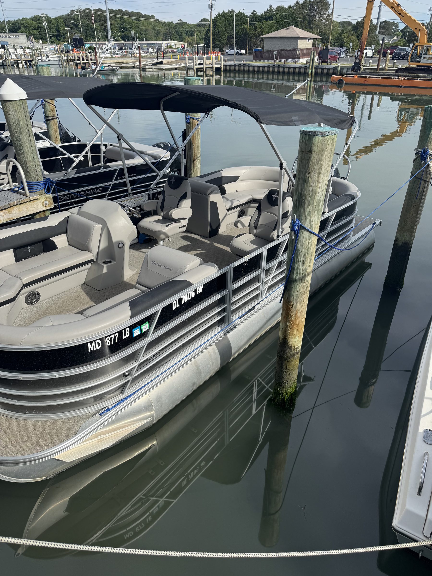 Berkshire 24RFX LE tritoon docked at OCA Watersports