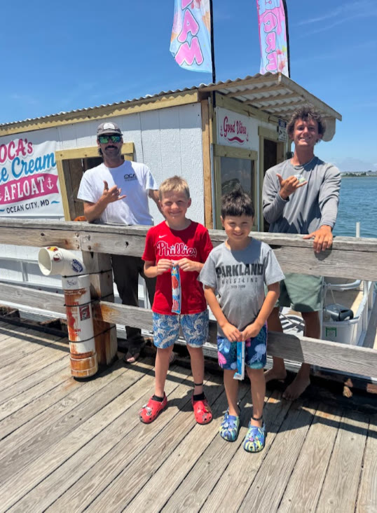 The Ice Cream Afloat crew serving young customers dockside at West Ocean City Harbor
