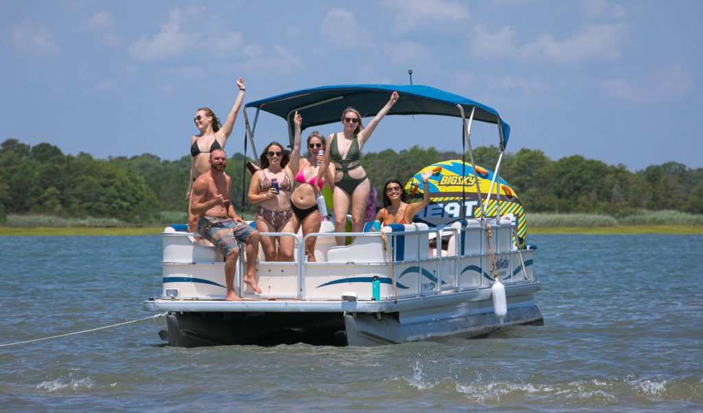 Group on a pontoon boat enjoying the Ocean City Maryland bay