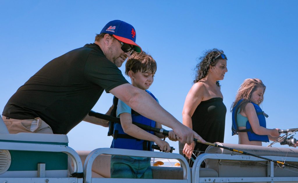 Family on pontoon boat