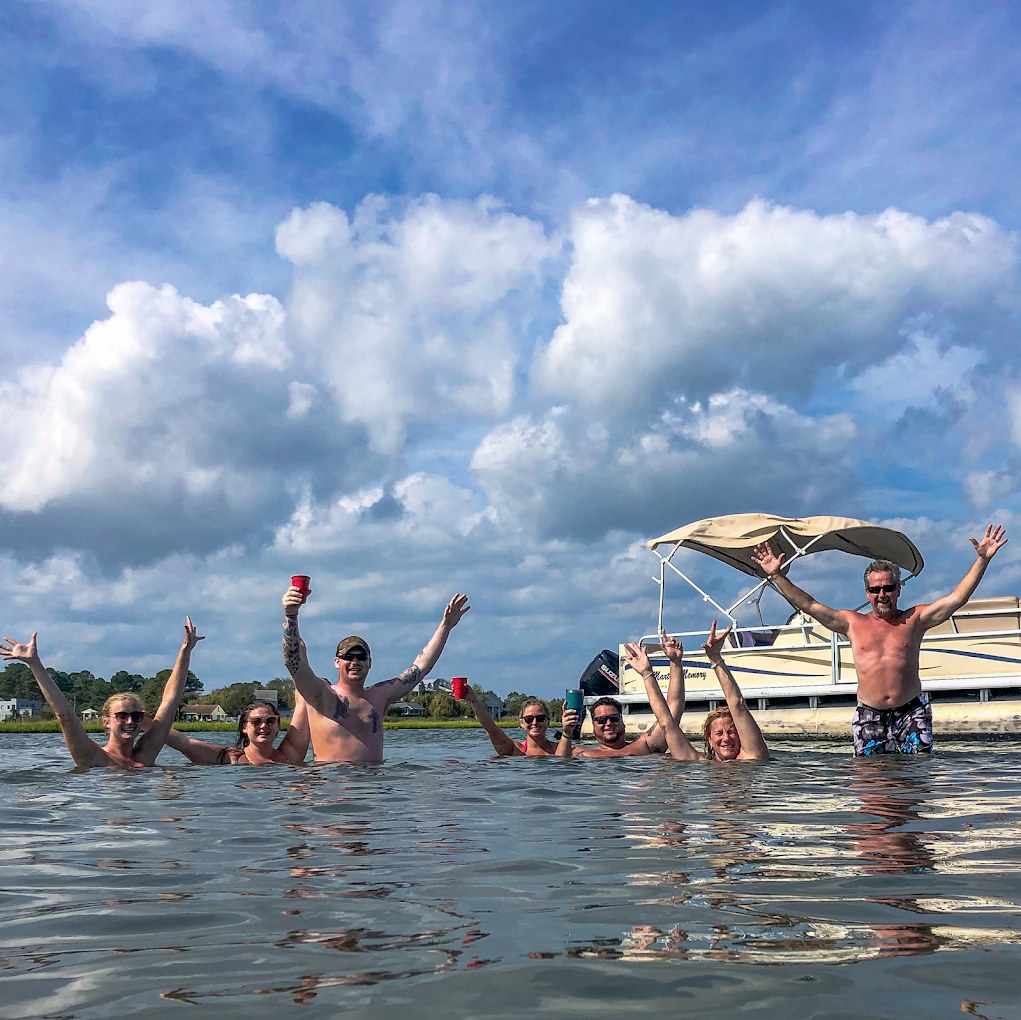 Pontoon boat docked at waterfront bar Ocean City